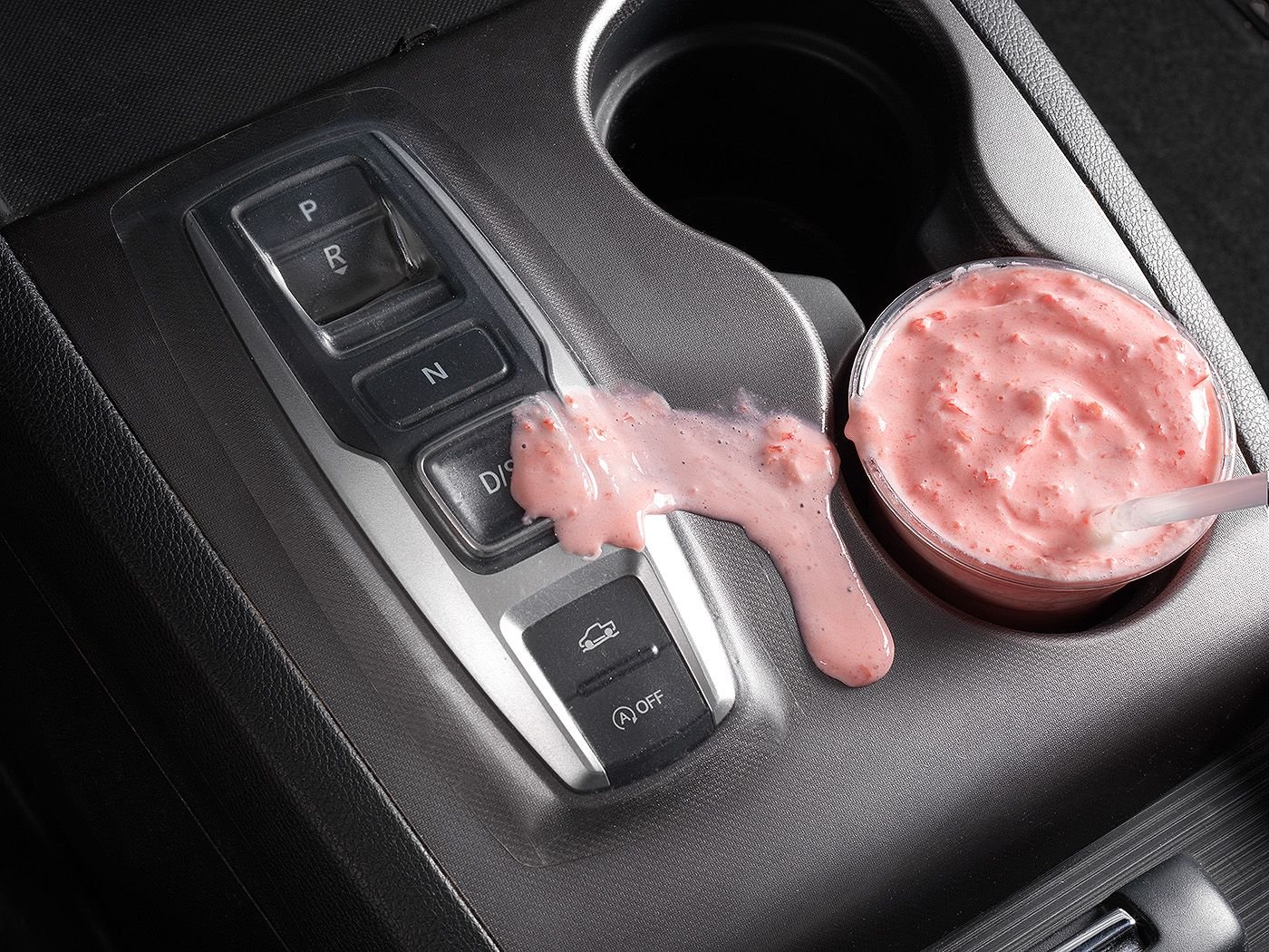 A strawberry smoothie spilled across a Honda push-button shifter that is protected by a clear Button Cover